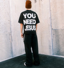 Load image into Gallery viewer, (DROP-SHOULDER/OVERSIZE BOXY-FIT) “YOU NEED JESUS” Black Tee
